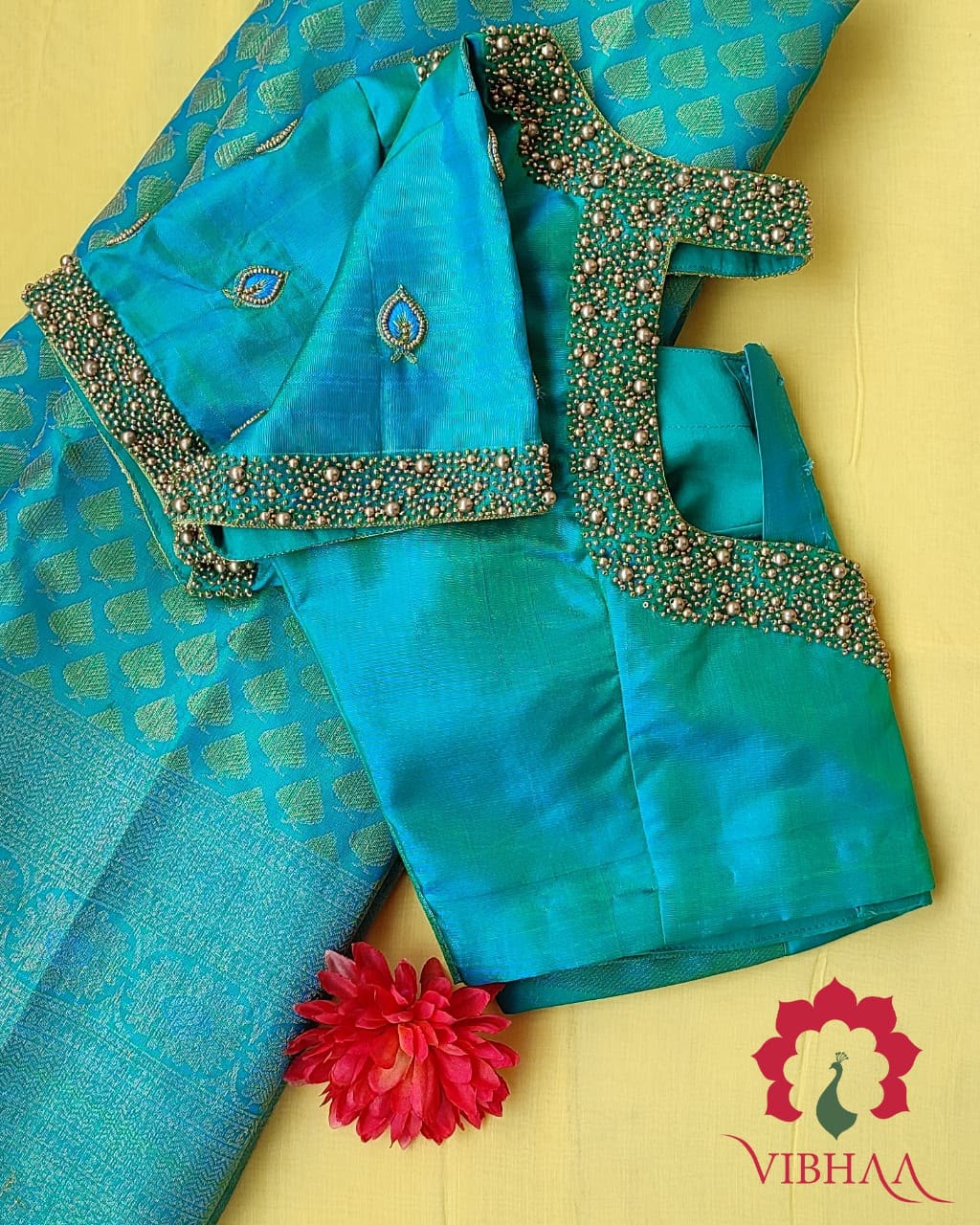 Hand-draped peacock green pure silk saree